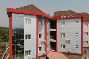 an external view of an apartment building at Alim Royal Hotel in Jahi