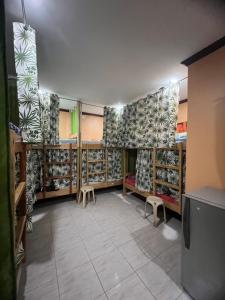 a room with shelves of shoes in a store at Stella'z guesthouse in Siquijor