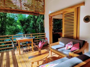 a living room with a couch and a table at Satta Lodge in Puerto Viejo