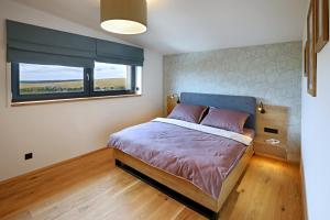 Postel nebo postele na pokoji v ubytování Apartmány Horizont