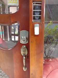 a pay phone with a mirror on the side of it at Posada J in Baños