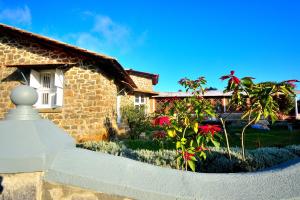 a stone house with a garden in front of it at Craigmore By Kodai Resort Hotel in Kodaikānāl