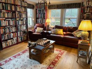 a living room with a couch and a coffee table at Clachan Garden B&B in Garve