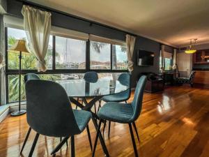 a dining room with a glass table and chairs at 111 6 Beautiful waterfront apartment near the beach in Fort Lauderdale