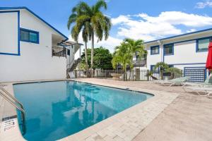 a swimming pool in front of a house at 111 6 Beautiful waterfront apartment near the beach in Fort Lauderdale