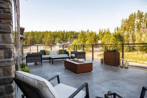 a patio with couches and a fire pit at Grand Cloudcroft Hotel in Cloudcroft