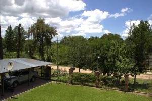 a house with a car parked in a yard at CV Apart in Resistencia