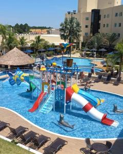 a pool at a resort with a water park at Vinhedo Plaza Hotel in Vinhedo