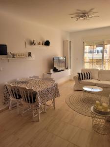 a living room with a table and a couch at Vista la Mar in Villaricos