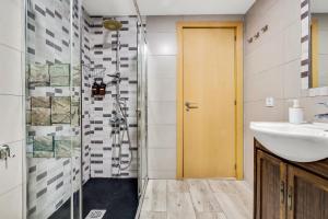 a bathroom with a sink and a shower at Los Nidos 603 By IVI Real Estate in Torremolinos