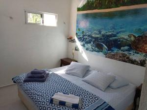 Łóżko lub łóżka w pokoju w obiekcie casa de los abuelos