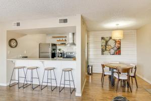 a kitchen and dining room with a table and chairs at Colorado Springs Condo with Fireplace Near Downtown in Colorado Springs