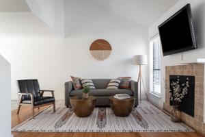 a living room with a couch and a fireplace at Locale Bouldin Creek - Austin in Austin