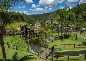 a park with a slide and a playground at Vale Encantado - Eco Park & Hotel in Biritiba-Mirim