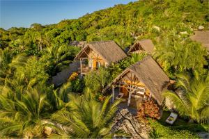 an aerial view of a resort with palm trees at Komba Cabana in Nosy Komba +40 photos