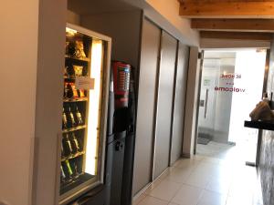 a refrigerator in a hallway with a door open at BE HOME Fiera in Pero