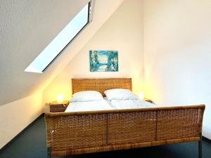 a bedroom with a bed with two pillows on it at Ferienwohnung Haus 2 in Timmendorf