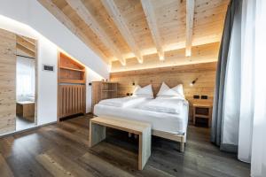 A bed or beds in a room at HOTEL B&B MARILENA