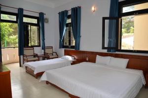 Postel nebo postele na pokoji v ubytování Resort Hoa Sim Da Lat