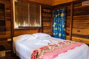 Postel nebo postele na pokoji v ubytování Cabañas Orlando y Más Na' Tayrona