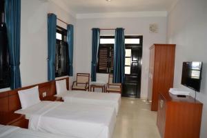 Postel nebo postele na pokoji v ubytování Resort Hoa Sim Da Lat + 10 fotografií
