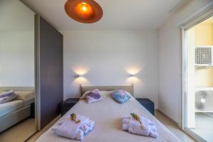Postel nebo postele na pokoji v ubytování Residence A Marina
