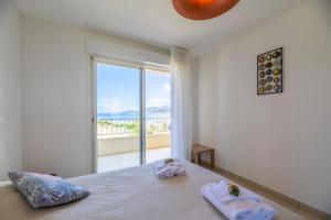 Postel nebo postele na pokoji v ubytování Residence A Marina