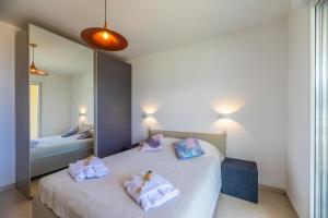 Postel nebo postele na pokoji v ubytování Residence A Marina