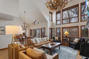 a living room filled with furniture and a chandelier at Wycham Place in Boone