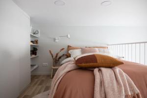 a bedroom with a bed with pillows on it at Central Gothenburg Retreat for 6 guests in Gothenburg