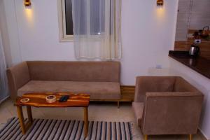 a living room with a couch and a coffee table at Anne in Dahab