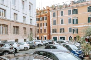 a bunch of cars parked in a parking lot at Vascellari home, Trastevere in Rome