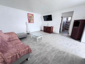 Televiisor ja/või meelelahutuskeskus majutusasutuses Élégant Appartement T3 Châtaigne : Spacieux