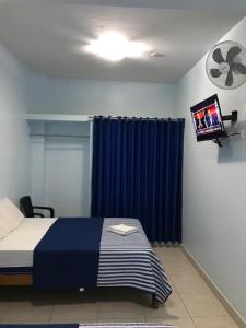 Áncora Beach Hotel tesisinde bir odada yatak veya yataklar