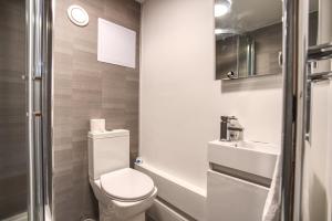 a small bathroom with a toilet and a sink at #59 Phoenix Court By DerBnB, Modern 1 Bedroom Apartment, Wi-Fi, Netflix & Within Walking Distance Of The City Centre in Sheffield
