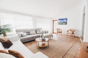 a living room with a couch and a table at Casa La Martina Frigiliana in Frigiliana