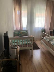 Postel nebo postele na pokoji v ubytování City Apartment