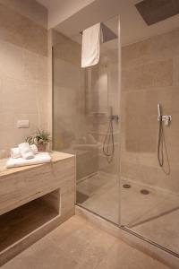 a bathroom with a shower with a glass door at HOTEL BARONE DI MARE in Torre dell'Orso