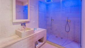 a bathroom with a shower and a sink and a shower at HOTEL BARONE DI MARE in Torre dell'Orso
