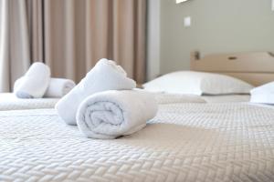 Postel nebo postele na pokoji v ubytování Zephyros Hotel