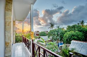 a balcony with a view of a resort at Nyuh Gading Home Stay in Nusa Lembongan