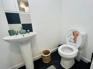 a bathroom with a toilet and a sink at Chic 1Bed Apt with Transport Links in Liverpool