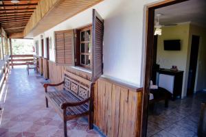 a room with a row of chairs and a bench at Vale Encantado - Eco Park & Hotel in Biritiba-Mirim