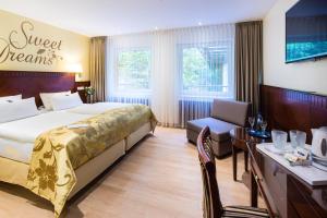 Postel nebo postele na pokoji v ubytování Marburger Hof + 34 fotografií