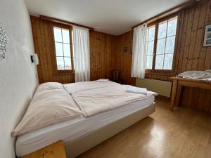 Letto o letti in una camera di Hôtel - Petit-déjeuner Le Trift