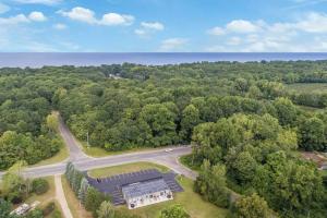 an aerial view of a building in the middle of a forest at A Slice of Blue Haven in South Haven