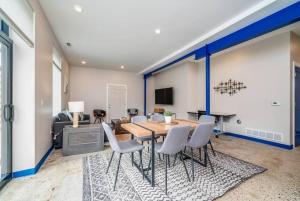 a dining room with a table and chairs at A Slice of Blue Haven in South Haven +8 photos