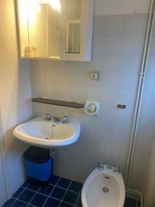 a bathroom with a sink and a toilet at Casa di Anna in Ravenna +15 photos