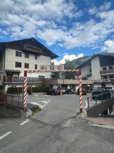 a parking lot in front of a building at Gloria Holiday Home Bormio in Bormio