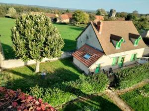 an aerial view of a house with a tree at Gîte Saint-Aubin-le-Monial, 4 pièces, 6 personnes - FR-1-489-490 in Saint-Aubin-le-Monial